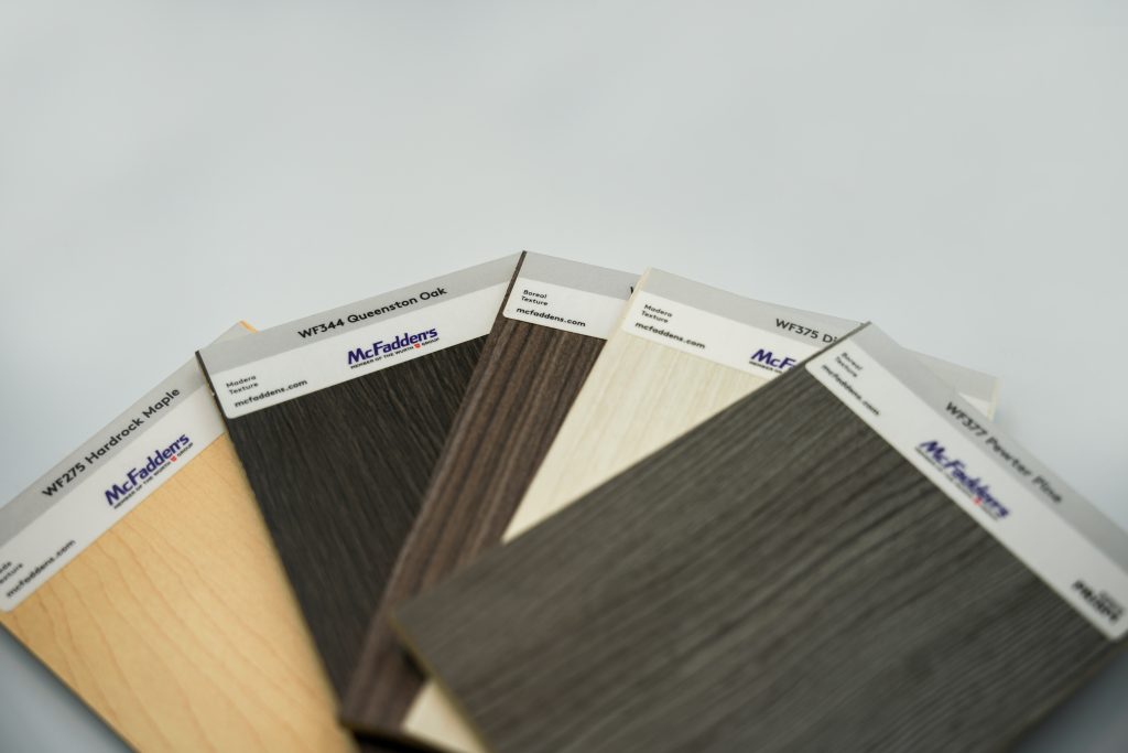 Five samples of Arauco melamine patterns that are part of the McFadden's Arauco melamine stock program
